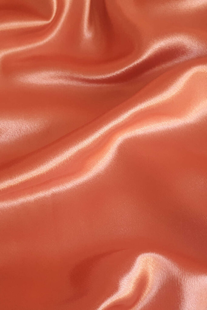 You won’t see “synthetic fabrics” listed on your clothing label, but it’s likely you’re wearing them right now. But how does that look from an environmental standpoint? Photo by Cindy C on Unsplash #syntheticfabrics #sustainablejungle