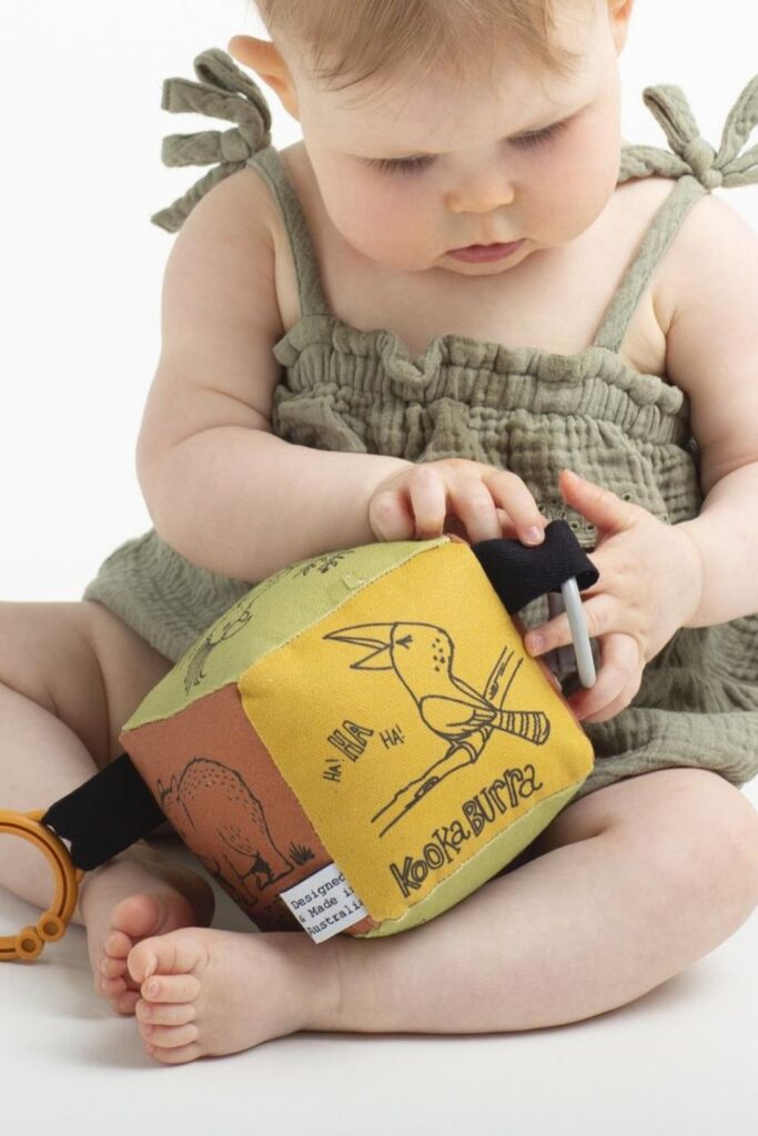 We've explored what it means to raise a zero waste baby, but what about zero fuss babies...you know, a baby playing happily with their new non toxic and organic baby toys. Image by finch and folk #organicbabytoys #organicbabytoysmadeintheusa #bestorganicbabytoys #nontoxicbabytoys #bestnontoxicbabytoys
