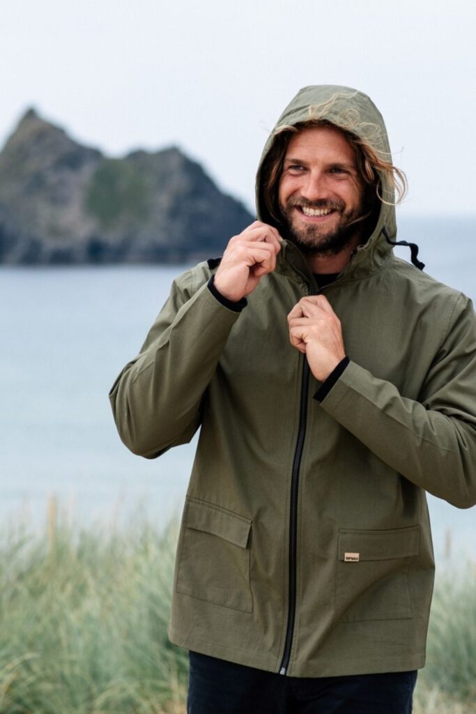 Climate change means more rainy days—making eco friendly rain jackets and coats a necessity. So we’ve weather-proofed our wardrobe considerations to find the best sustainable raincoats for you. Image by Rapanui #sustainablerainjackets #bestsustainablerainjackets #ecofriendlyrainjackets #sustainableraincoats #bestsustainableraincoats