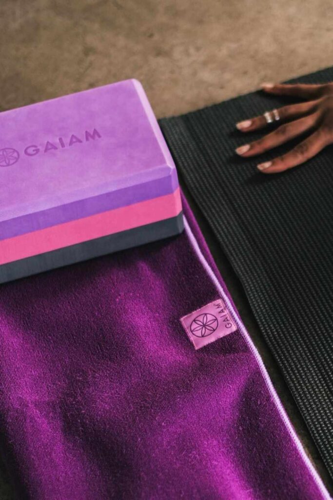 Sustainable yoga props and accessories, like blocks, balls, straps, and bolsters, can help yogis of all levels with flexibility, stability, AND sustainability. Image by Gaiam #sustainableyogaprops #sustainableyogaaccessories #sustainablejungle