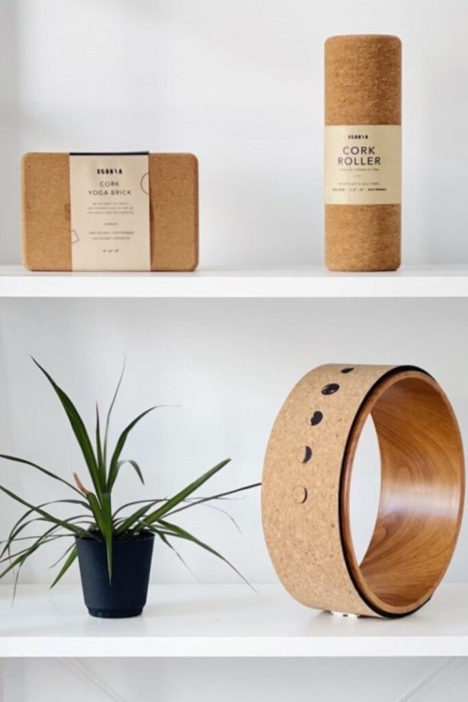 Sustainable yoga props and accessories, like blocks, balls, straps, and bolsters, can help yogis of all levels with flexibility, stability, AND sustainability. Image by Scoria #sustainableyogaprops #sustainableyogaaccessories #sustainablejungle