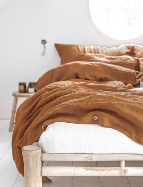 11 Sustainable Bedding Brands Tucking You In Without Toxins Image by MagicLinen #sustainablebedding #affordablesustainablebedding #sustainablesheets #ecofriendlybedding #ecofriendlysheets #sustainablejungle