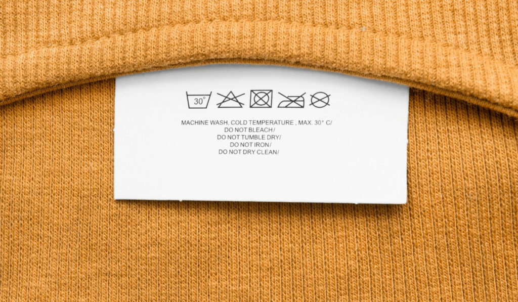 How To Read Clothing Labels: Demystifying the Numbers and Symbols #howtoreadclothinglabels #howtoreadclotheslabels #howtoreadclothestags #howtoreadclothingtags #howtoreadfabriccarelabels #sustainablejungle Image by Tarzhanova via Getty Images on Canva Pro