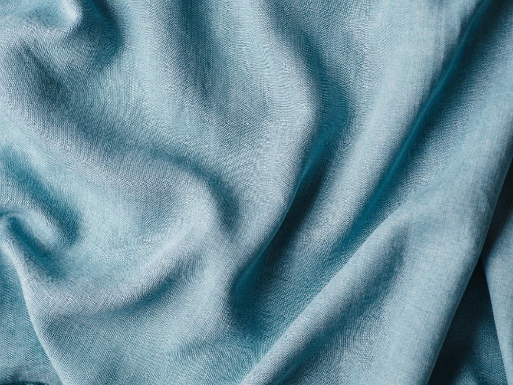 What Is Lyocell Fabric & Is Its Sustainability Up To Snuff? #lyocellfabric #lyocelltencelfabric #islyocellfabricsustainable #tencellyocell #whatislyocellfabric #sustainablejungle Image by Fascinadora via Getty Images on Canva Pro