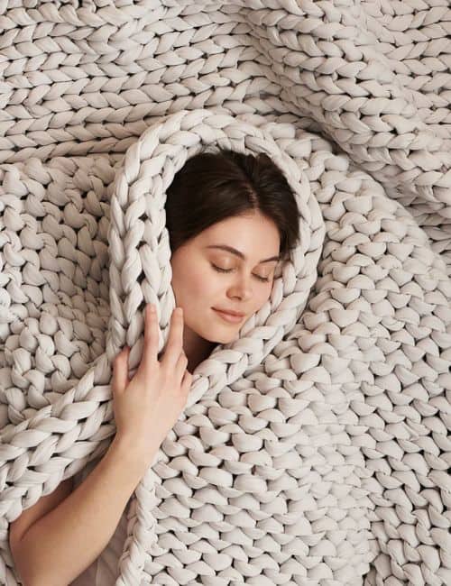 9 Fair Trade & Sustainable Blankets For All The Conscious Cozies Image by Bearaby #sustainableblankts #sustainablethrows #sustainablethrowblankets #fairtradeblankets #handwovenfairtradeblankets #fairtradethrows #sustainablejungle