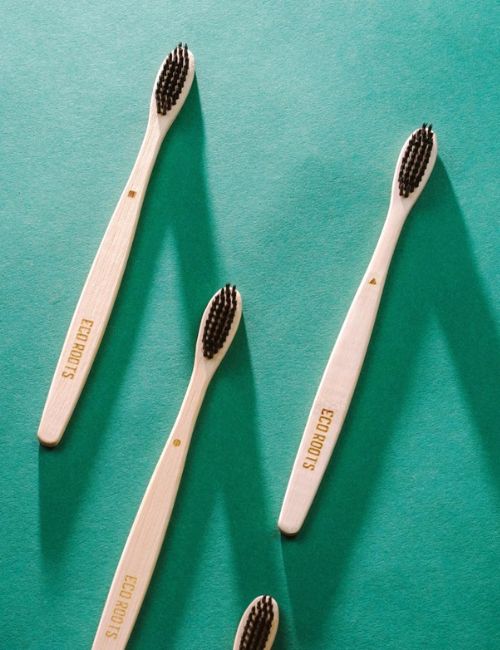9 Zero Waste & Sustainable Toothbrushes Cleaning The Planet & Your Pearly Whites Image by EcoRoots #sustainabletoothbrushes #mostsustainabletoothbrush #sustainablebambootoothbrush #zerowastetoothbrush #bestzerowastetoothbrush #bambootoothbrushzerowaste #sustainablejungle