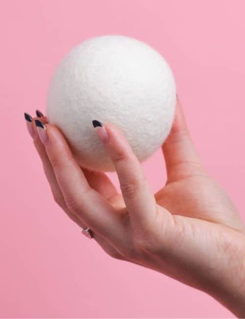 9 Reusable Dryer Balls To Put An Eco-Friendly Spin On Laundry Day Image by EcoRoots #dryerballs #resuabledryerballs #ecofriendlydryerballs #wooldryerballs #laundrydryerballs #ecofriendlywooldryerballs #dryerlintballs #sustainablejungle