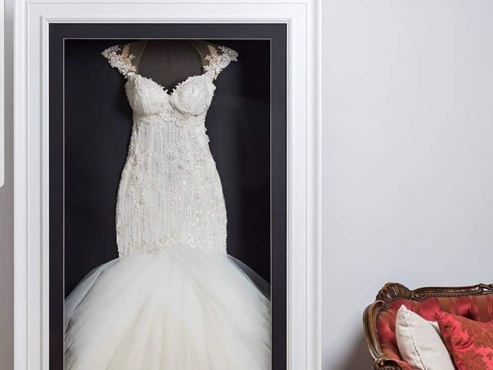 What to Do With Old Wedding Dresses: 11 Recycling Ideas To Take It From Sentimental to Sustainable Image by The Beautiful Frame Company #whattodowithodlweddingdress #whattodowitholdweddingdresses #whattodowithyouroldweddingdress #recycleweddingdress #weddingdressrecycling #weddingdressrecycleideas #sustainablejungle