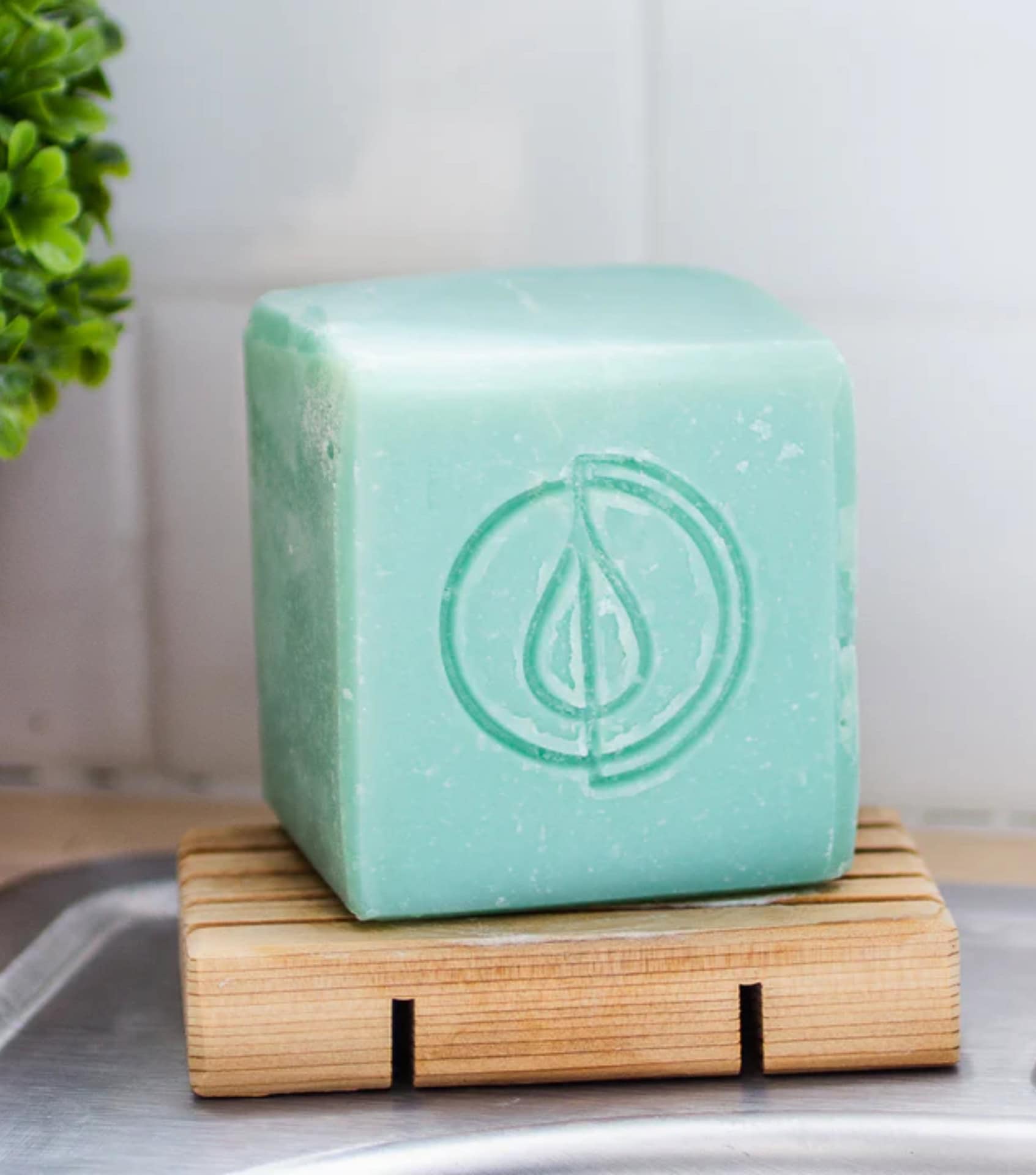 A Drop in the Ocean non-toxic dish soap bar on wooden soap dish, zero waste package-free cleaning product