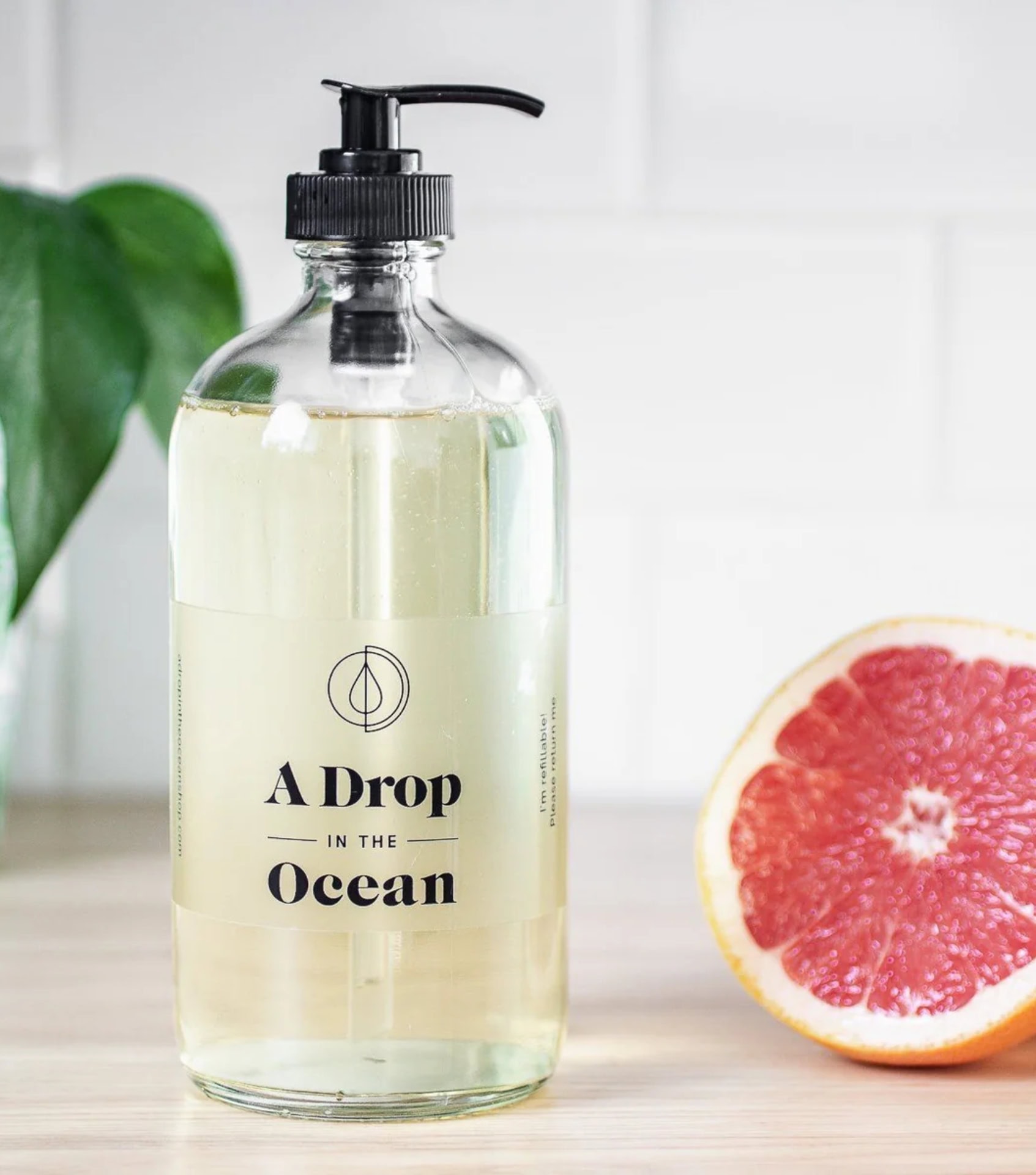 A Drop in the Ocean refillable liquid dish soap in glass bottle with grapefruit, non-toxic biodegradable formula