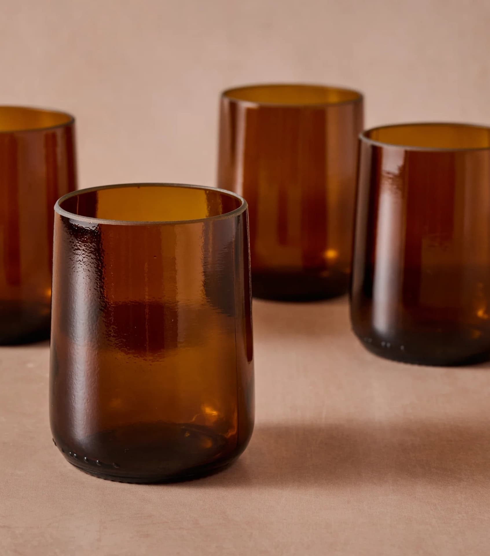 Sustainable home decor brands showcasing amber recycled glass tumblers (Gronn)