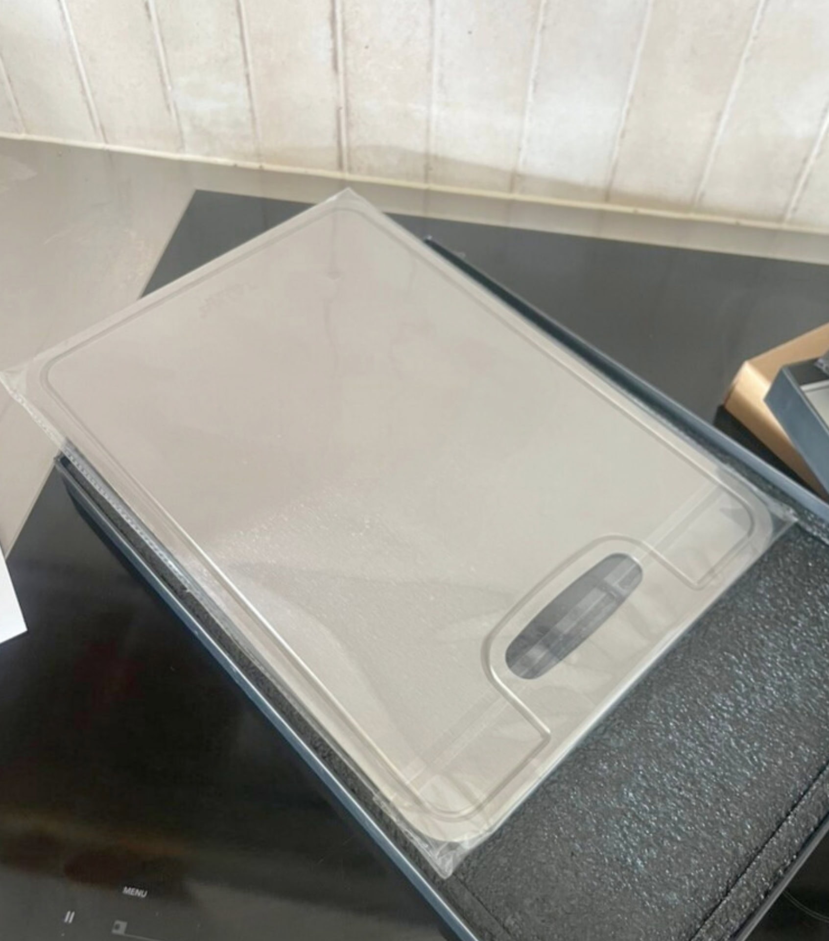 Close-up of Taima Grade 1 pure titanium cutting board showing non-porous hygienic surface for chemical-free food prep